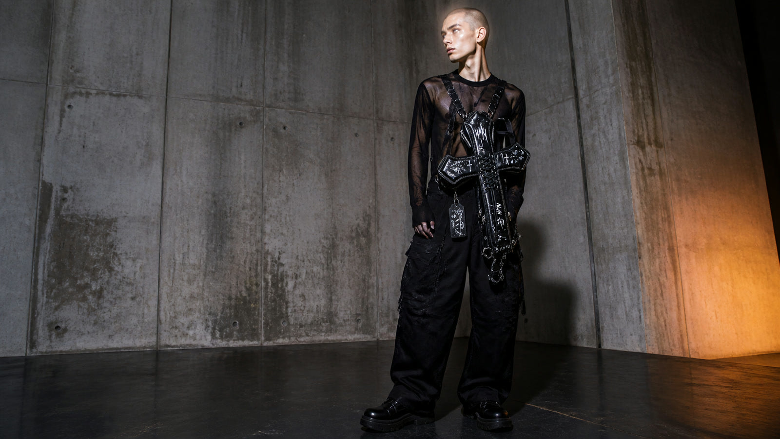 Black DEADLOOM Cross Bag worn in a full-body campaign view