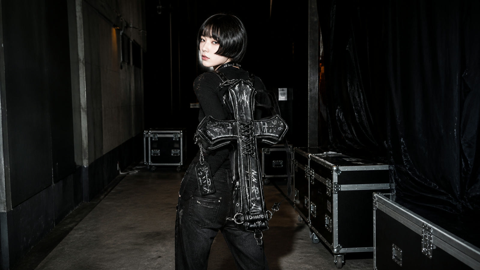 Black DEADLOOM Cross Bag shown from the back on body